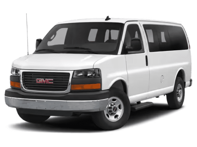 White GMC passenger van, front and side view, showcasing dark tinted windows and side mirrors.