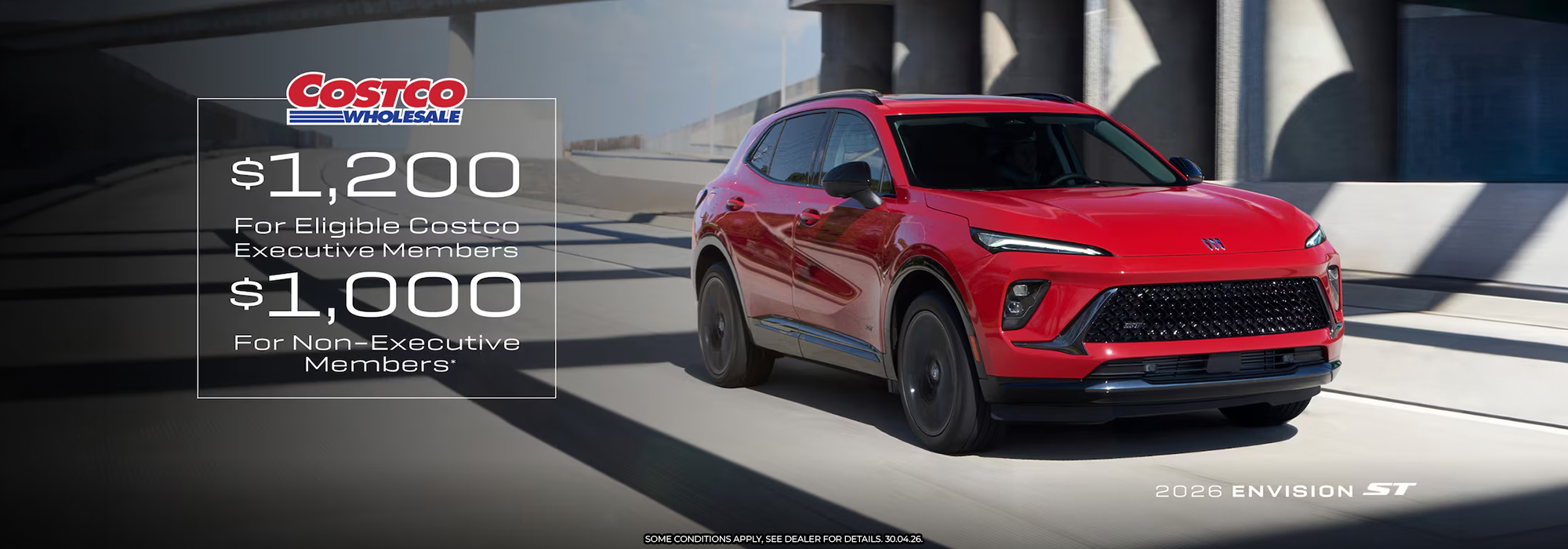 Red 2026 Envision ST on road, Costco savings: $1,200 for executive, $1,000 for non-executive members.