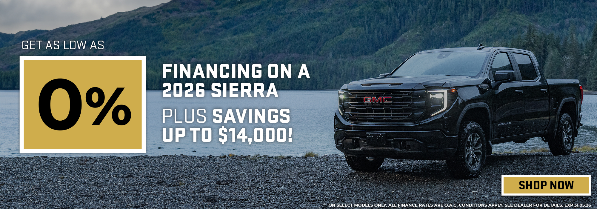 2026 GMC Sierra by a lake with 0% financing offer and up to $14,000 savings. Shop now prompt.