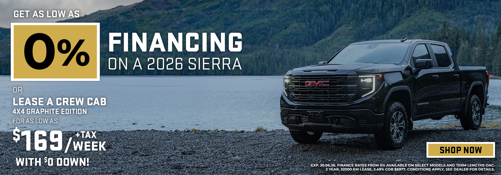 2026 GMC Sierra by a lake with 0% financing offer and up to $14,000 savings. Shop now prompt.