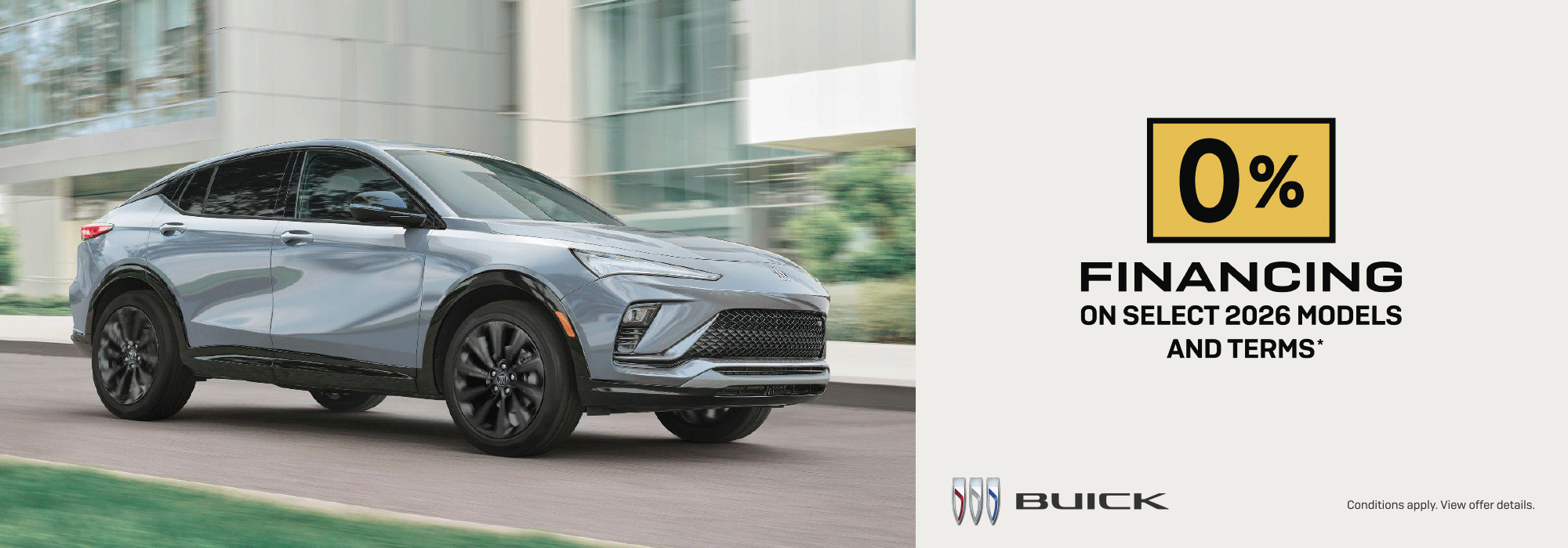 Buick SUV on road with 0% financing offer for select 2026 models and terms. Conditions apply.