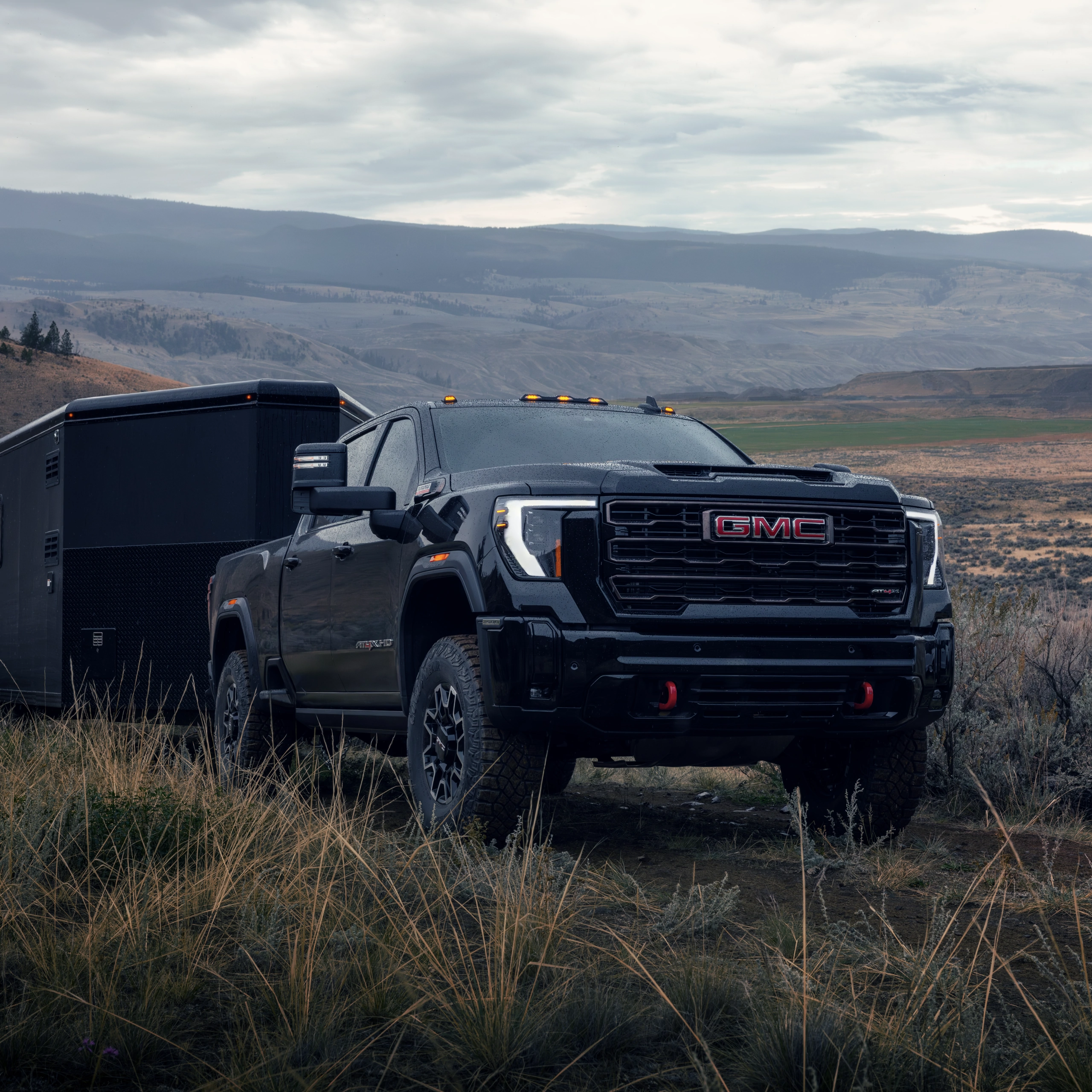 A Ford Bronco navigating rocky terrain under a clear blue sky, showcasing its off-road capabilities.